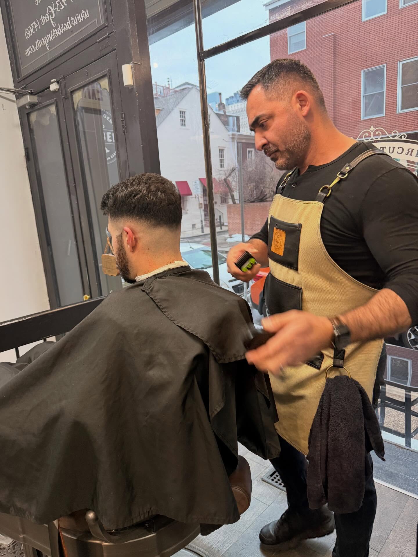 A barber at work in the Pine Street shop